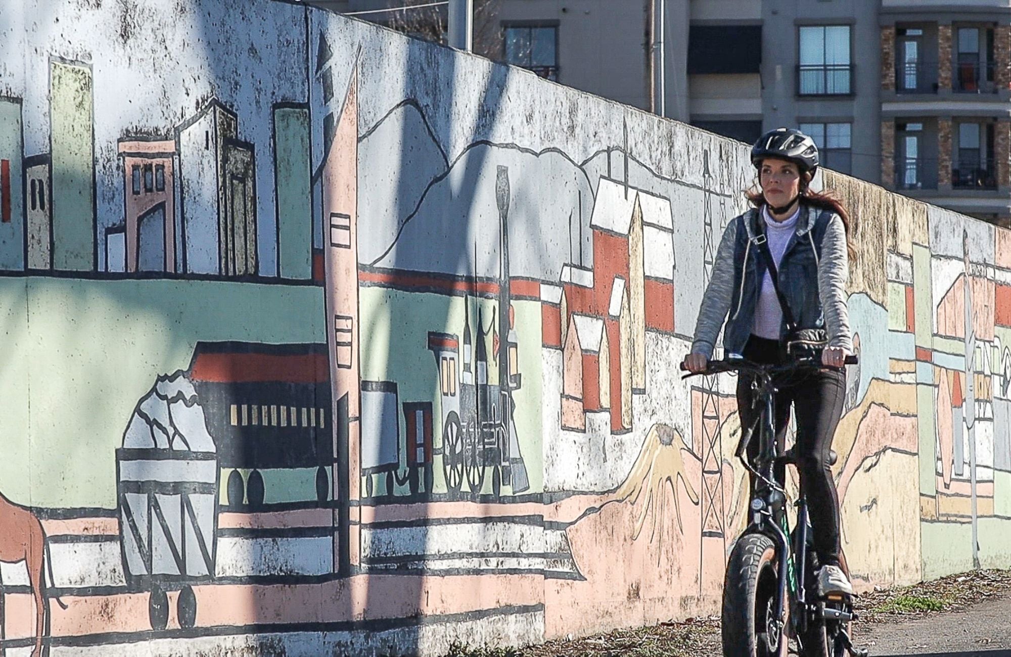 Woman riding Emerald Ebike using an ebike app