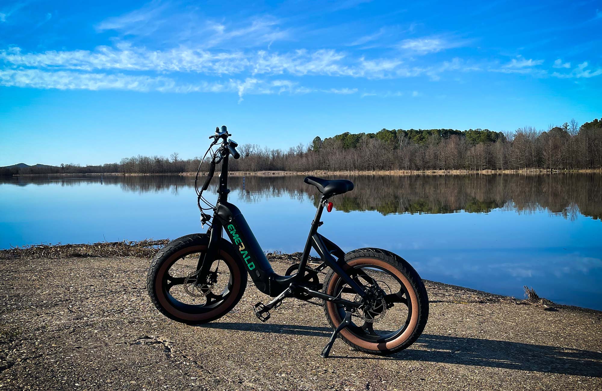 Woman stops her ebike to look at an ocean view
