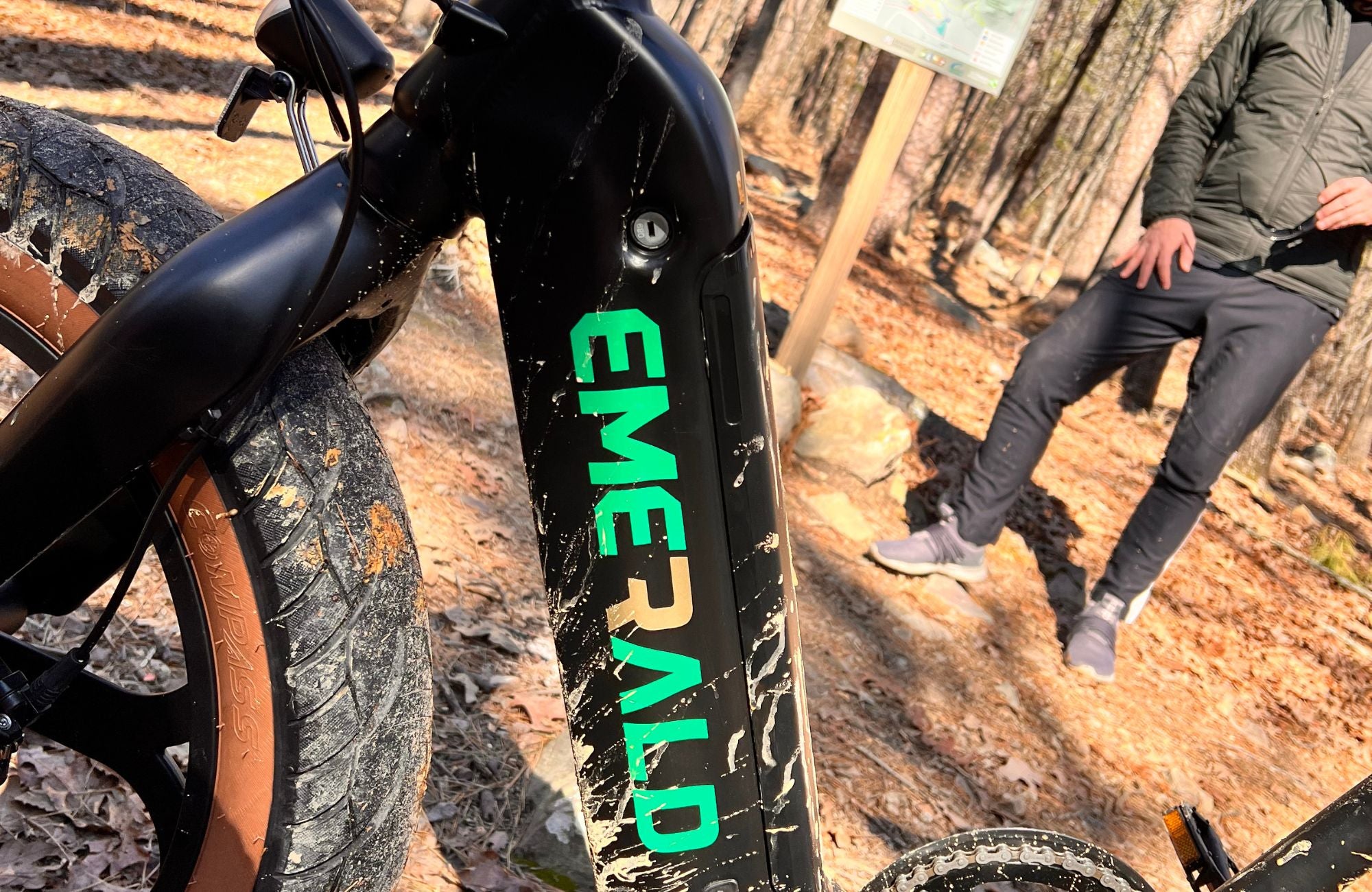 Up close view of muddy Emerald Ebike on a mountain trail