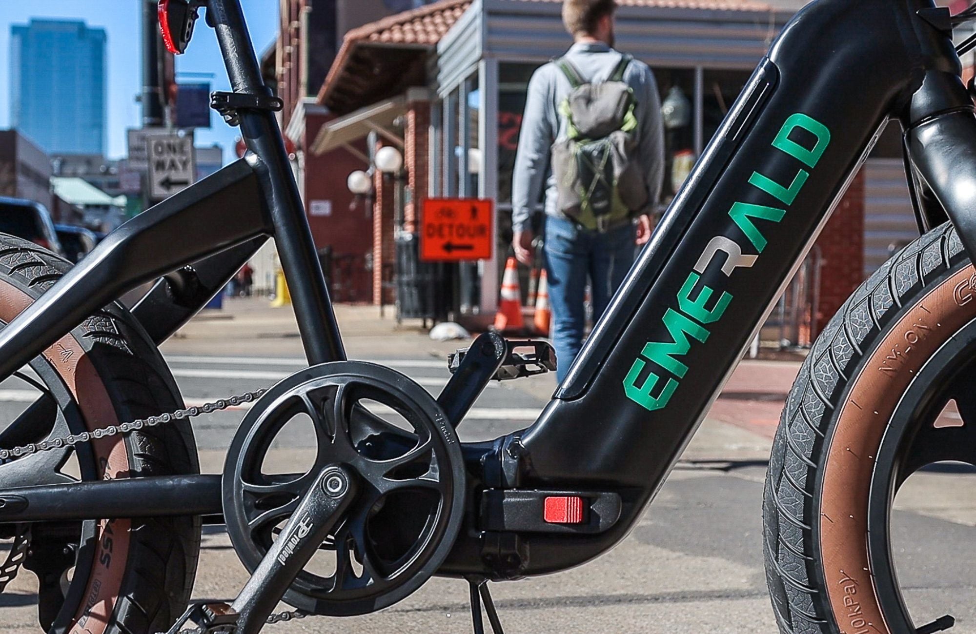 Up close view of Emerald Ebike with pedestrian in the background.