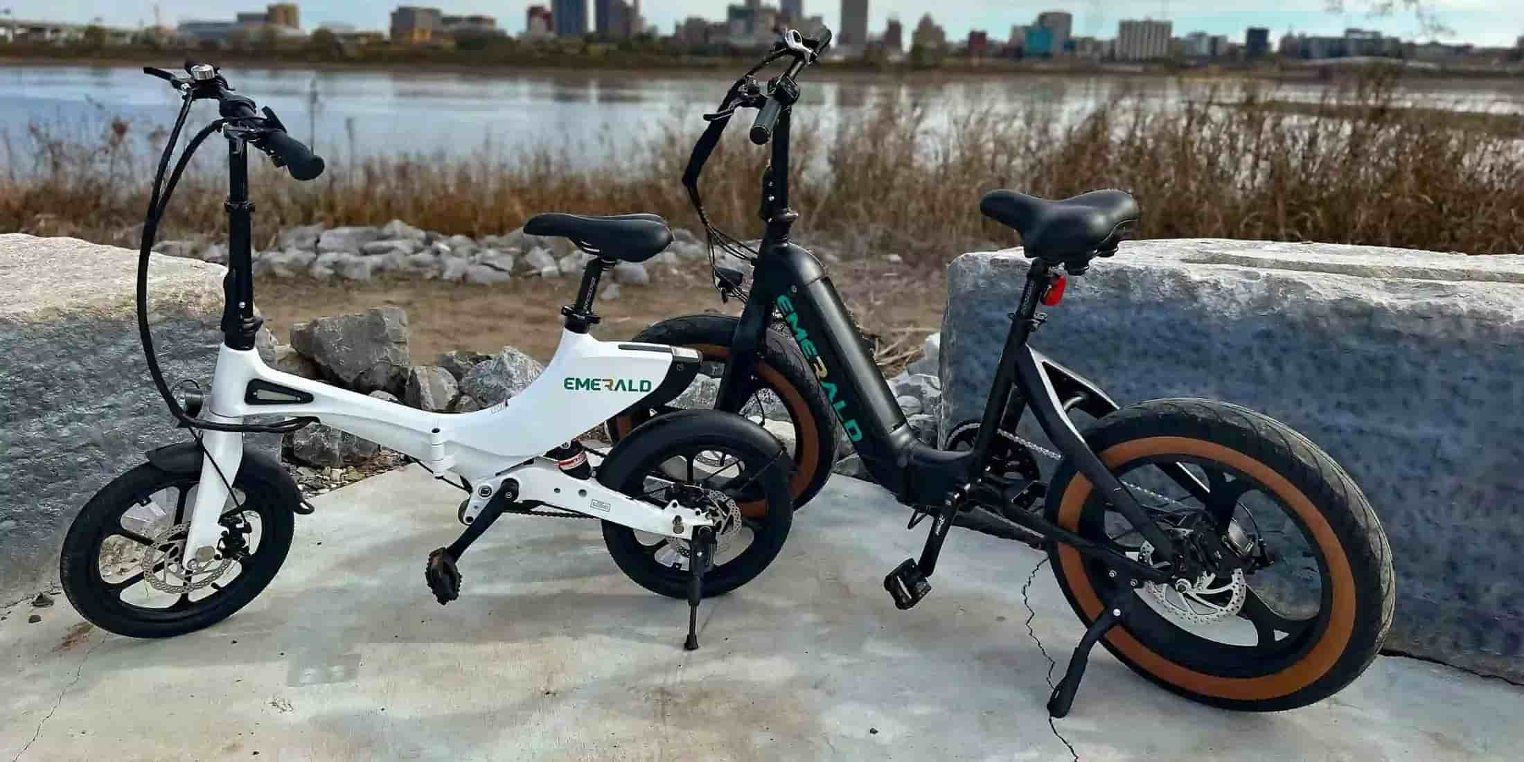 emerald ebikes parked by the river.