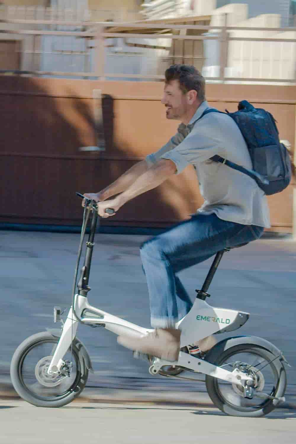 man riding ebike in the city