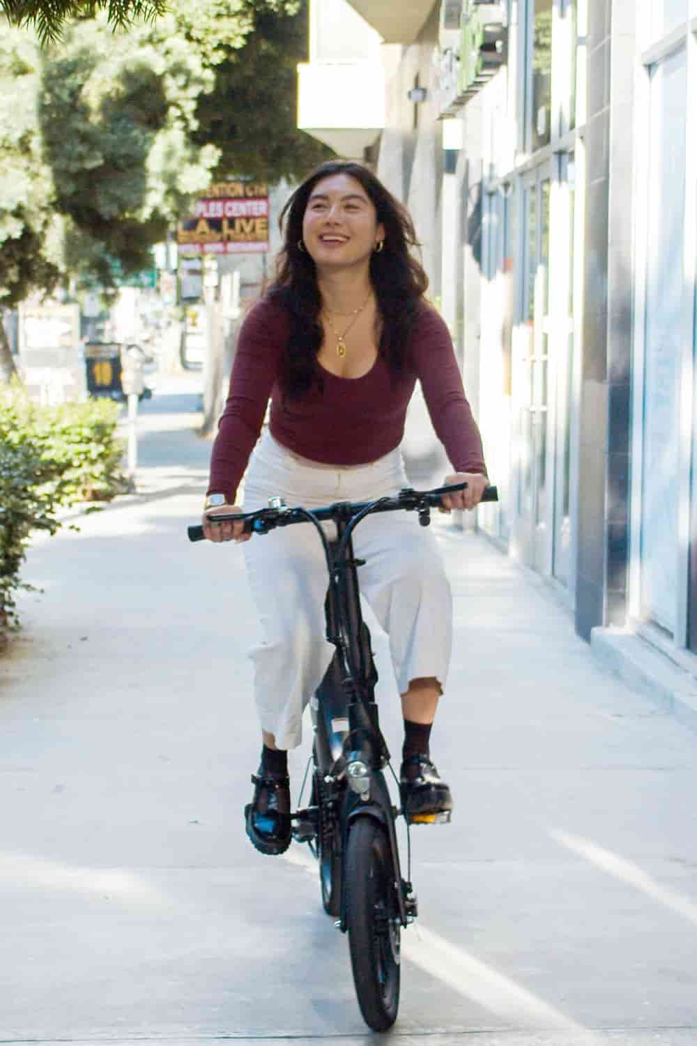 Girl riding ebike in the city